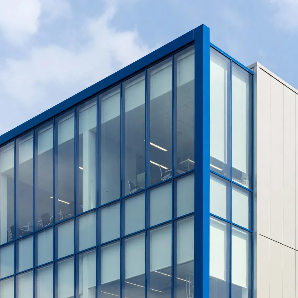 Office building with blue aluminium window frames.